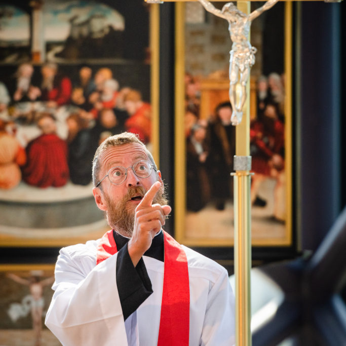 The Rev. William Weedon, director of LCMS worship, points to the cross as he preaches his final sermon before his retirement at the International Center of The Lutheran ChurchñMissouri Synod on Thursday,  Aug. 29, 2019, in St. Louis. LCMS Communications/Erik M. Lunsford